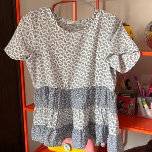 White and blue patterned blouse